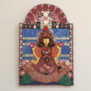 A mixed media mosaic featuring a central female figure with four arms who is seated on a lotus lflower and offering gifts from her hands.