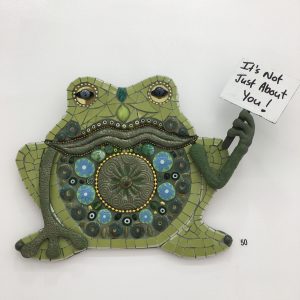 Mixed media frog holding a protest sign